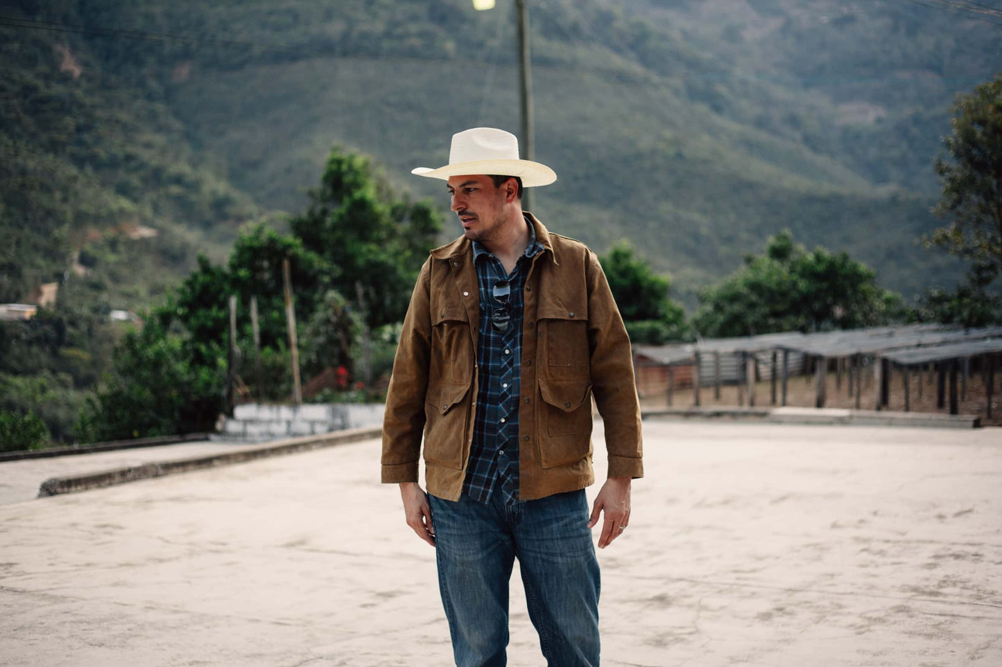 edwin martinez, coffee farmer stands on his coffee farm