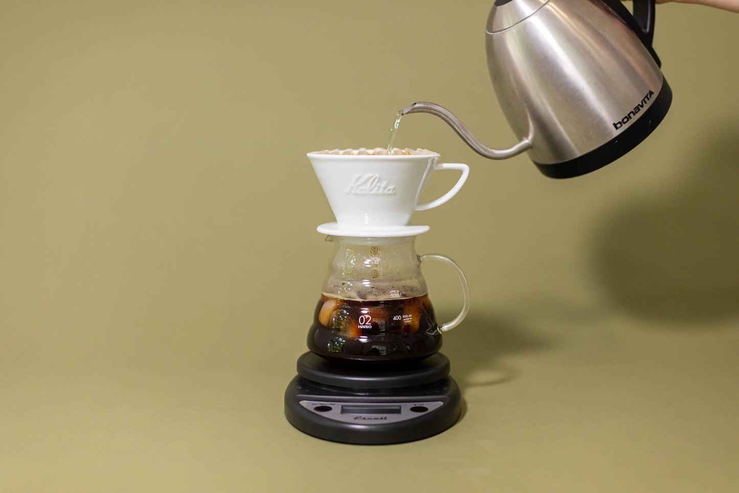kalita coffee brewer on glass carafe on scale